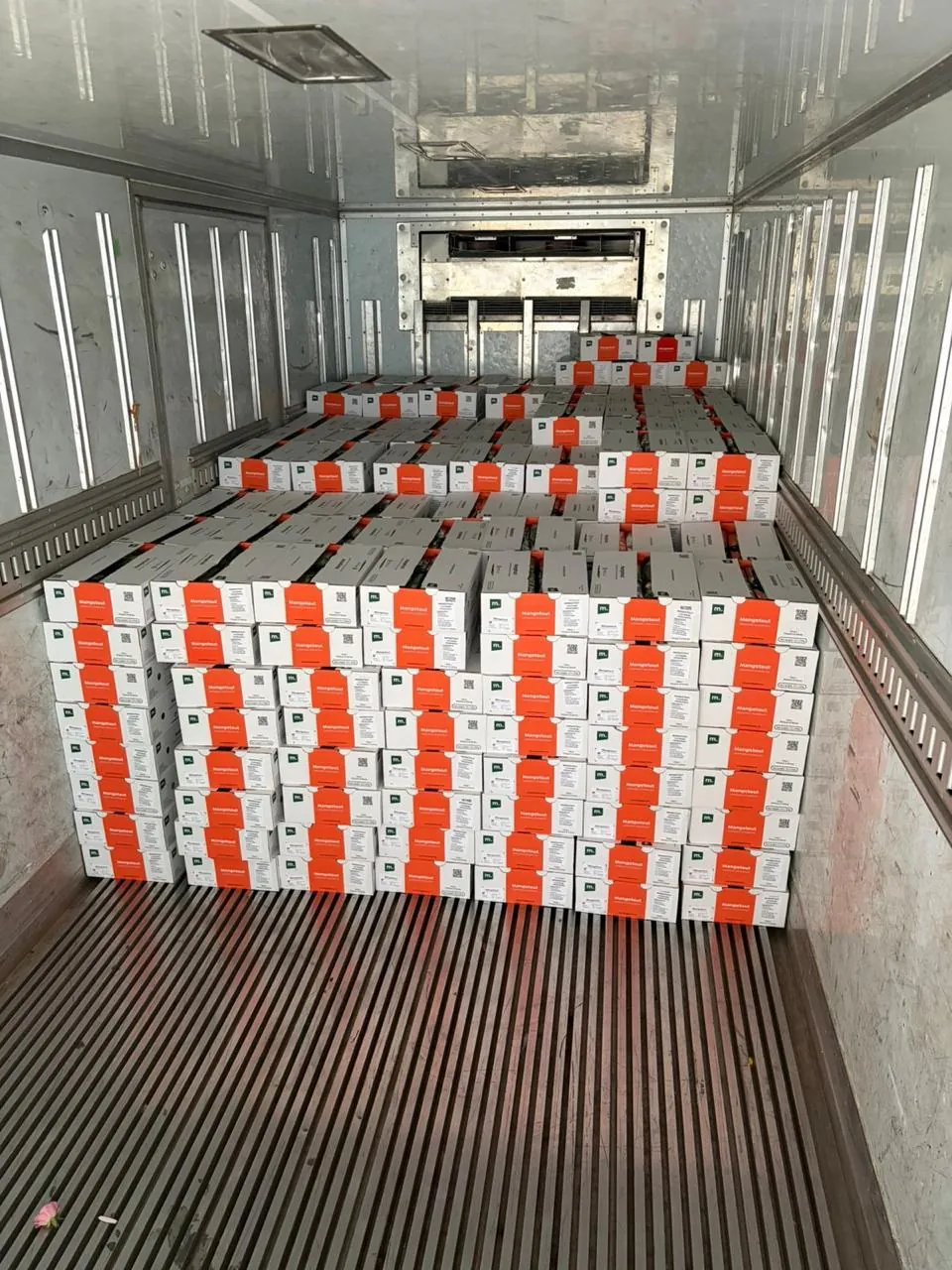 Cartons stacked inside a refrigerated truck